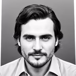 a man with long hair wearing a tie