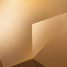 a wall with a triangular light shade, in a neutral lit room
