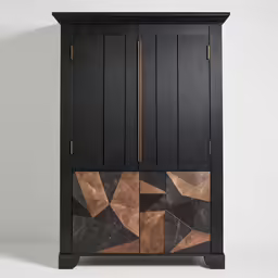an upclose cabinet with black wood painted design