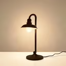 an old fashion lamp sitting on top of a table