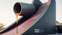 the liquid flowing out of the pipes on top of the building