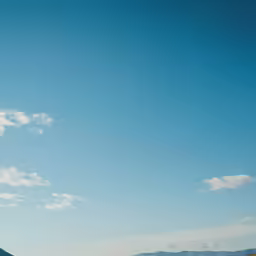 two people riding bikes on the open highway
