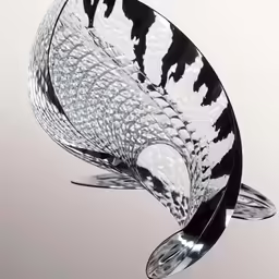 a black and white glass dish with metal handles