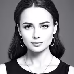 a woman is in black and white posing for the camera