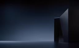 a black cube standing next to each other on a floor