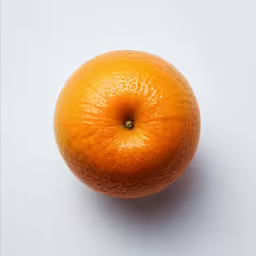 an orange is shown on a white surface