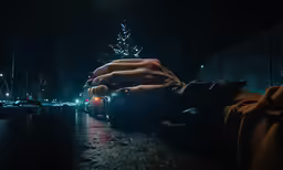 this is a picture of someones hands on the edge of a bench