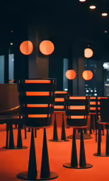 rows of chairs in the middle of a dark room
