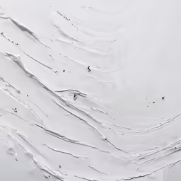 several small water skiers ride through snow