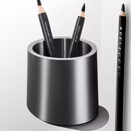 a cup with pencils and two other types of pens