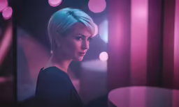 a close - up of a person with short blonde hair