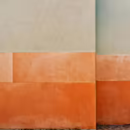 there is a man walking near a colorful building