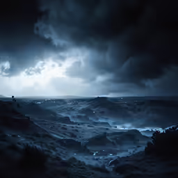 a person standing on top of a mountain looking at the ocean