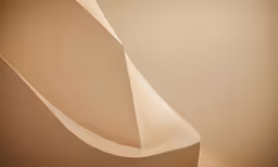 a sculpture with a curved corner between the top and bottom