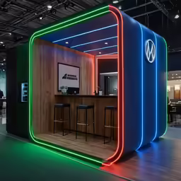 a volkswagen booth on a show floor that features neon lighting