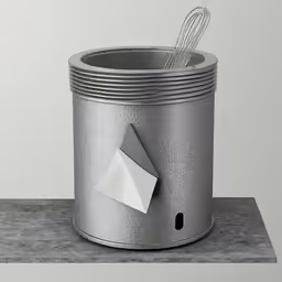 a silver can with a paper airplane sticking out