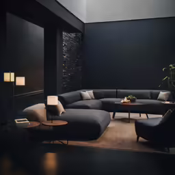 a grey living room with chairs and table