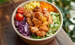 a bowl filled with a variety of vegetables
