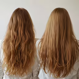 the woman is showing off her long hair