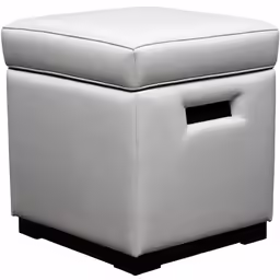a white foot stool with a buttoned seat