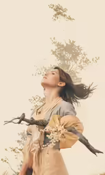 woman with long brown hair holding a long branch