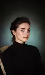 a young woman wearing a black sweater sitting down
