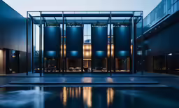 an interior courtyard of a building lit up with lights