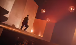there is a man walking down the hallway