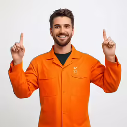 smiling guy in orange shirt making the middle finger sign