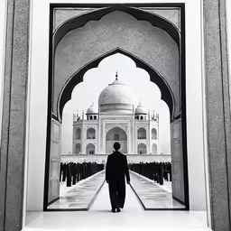 man in suit walking in front of an arch that is decorated with many columns