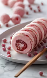 an animal laying on a plate with a knife