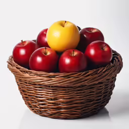 a brown basket filled with lots of fruit