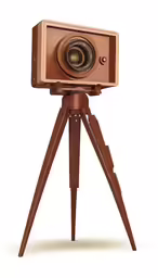 a brown camera is mounted on top of a tripod