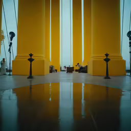 three black lights are sitting in front of columns