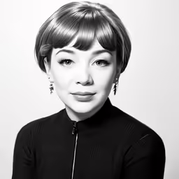 black and white photo of a woman with bangs