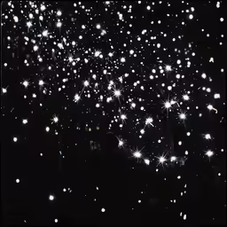 many fireworks are going off in the night sky