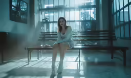 a woman sitting on top of a bench