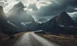 a road running through the middle of two mountain side