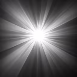 an image of a light shining on black and white