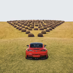 a red car parked in the middle of a field of hay