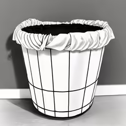 a large black and white pot is sitting against a gray wall