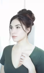 an asian lady has very hottied up to her neck