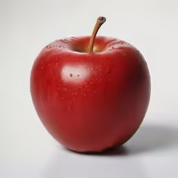 an apple is photographed against a white background