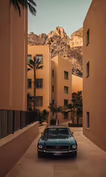 a blue vintage car parked in the middle of the desert