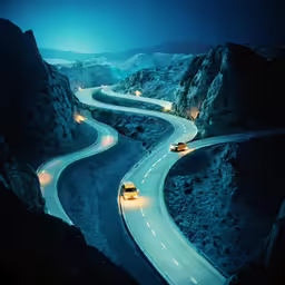 the road is winding up into the mountains