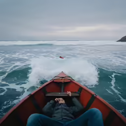 the back end of a boat with a person riding in it