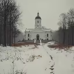 an old church sitting in the snow surrounded by tall trees