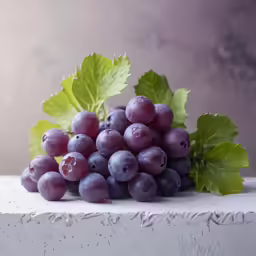 a bunch of grapes sitting on top of a ledge