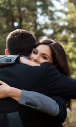 a couple hug each other and have an embrace