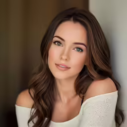 a beautiful young lady posing for a photo